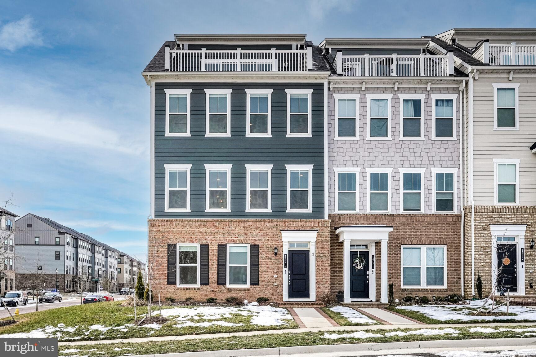 1769 Riverbluff Avenue Dumfries, VA 22026 - Photo 1 of 31 a front view of a building with a yard