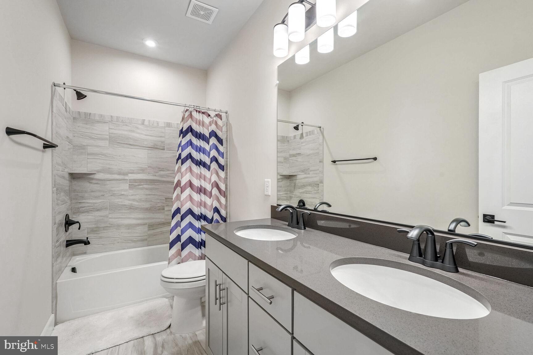 1769 Riverbluff Avenue Dumfries, VA 22026 - Photo 16 of 31 a bathroom with a sink a toilet and shower