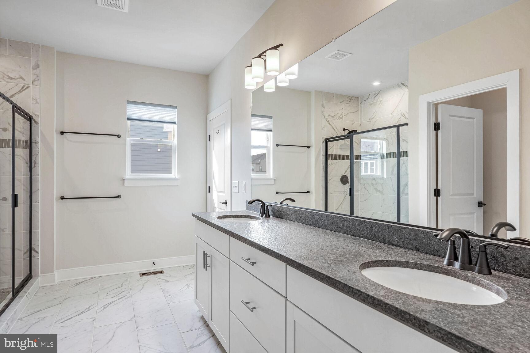 1769 Riverbluff Avenue Dumfries, VA 22026 - Photo 19 of 31 a bathroom with a granite countertop double vanity sink mirror and shower