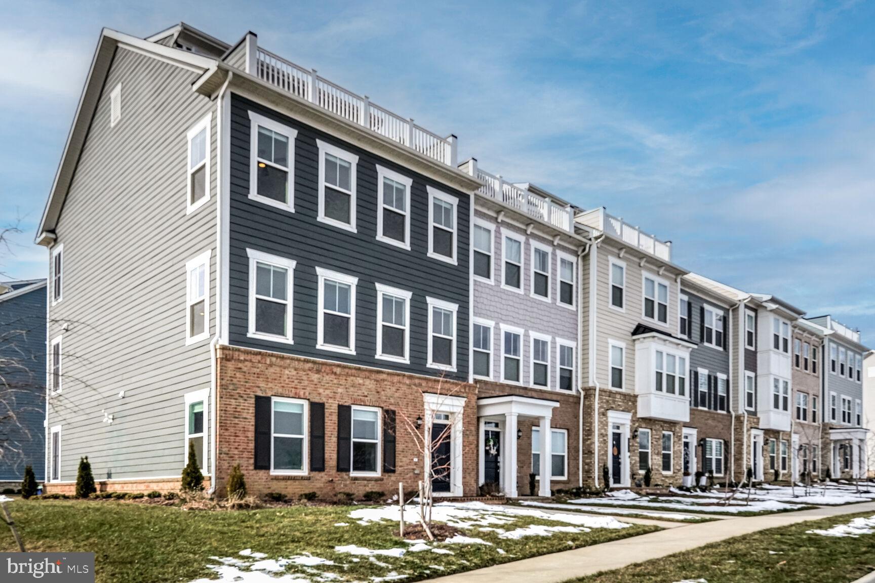 1769 Riverbluff Avenue Dumfries, VA 22026 - Photo 2 of 31 a front view of a building with a yard