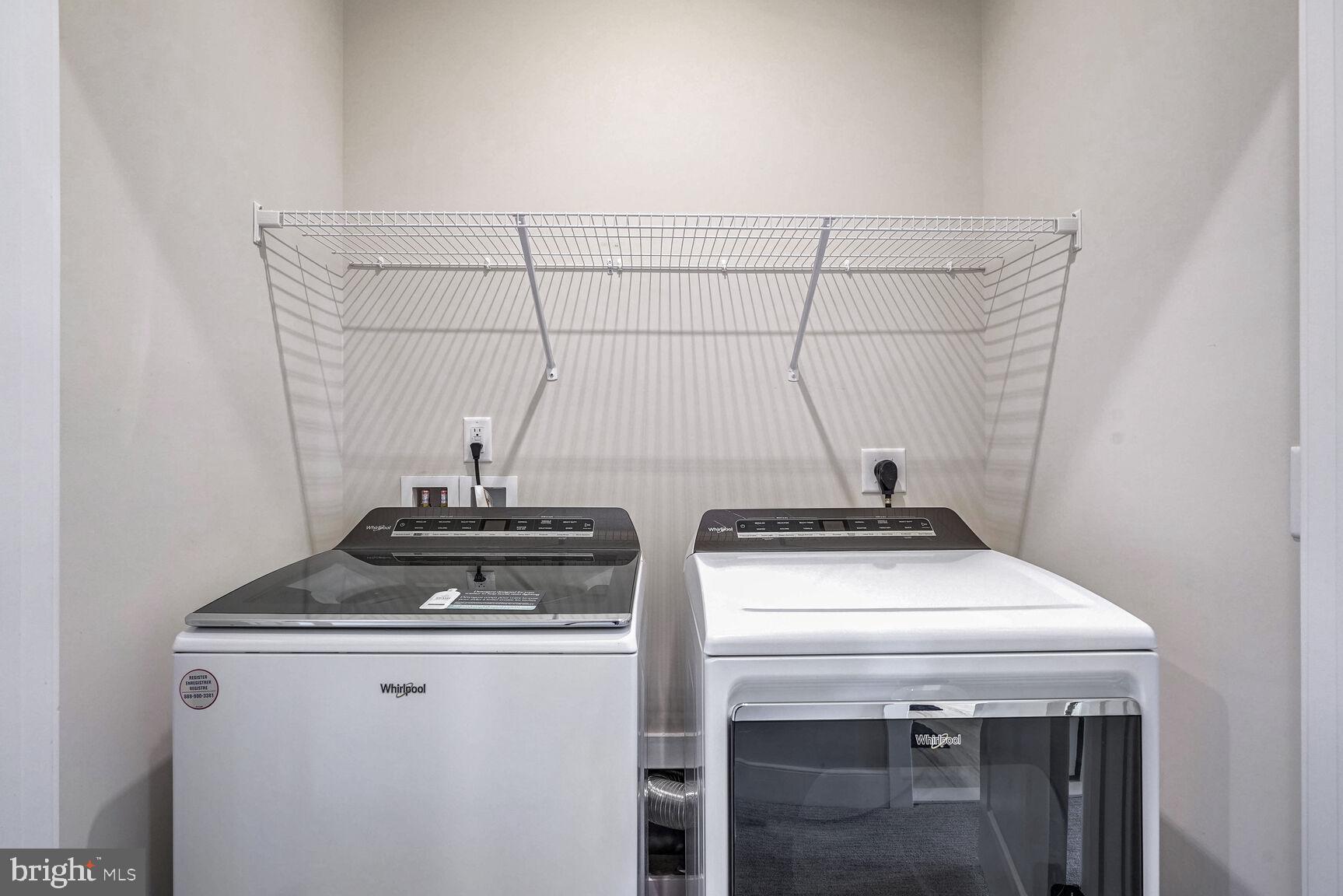 1769 Riverbluff Avenue Dumfries, VA 22026 - Photo 22 of 31 a view of storage and utility room with washer and dryer