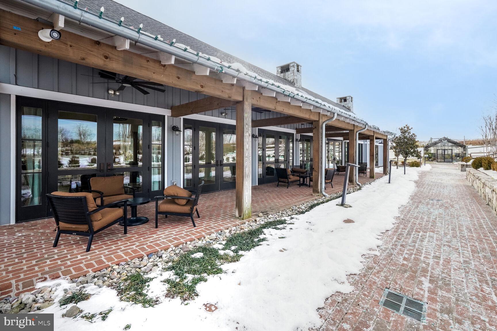 1769 Riverbluff Avenue Dumfries, VA 22026 - Photo 29 of 31 a view of a patio with table and chairs and potted plants