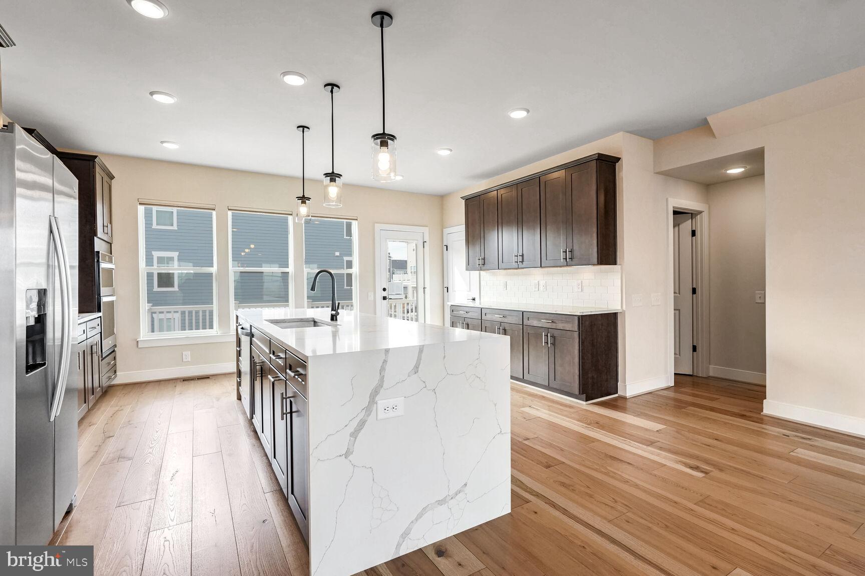 1769 Riverbluff Avenue Dumfries, VA 22026 - Photo 4 of 31 a view of a kitchen with cabinets and wooden floor