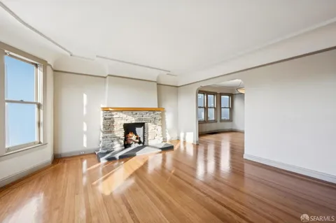 a view of fireplace and wooden floor