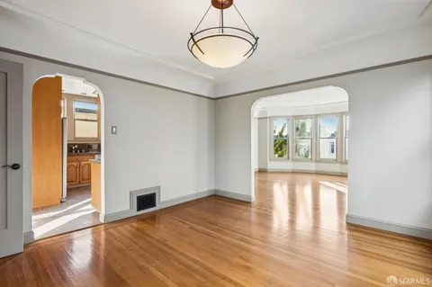 a kitchen with stainless steel appliances granite countertop a refrigerator stove and sink