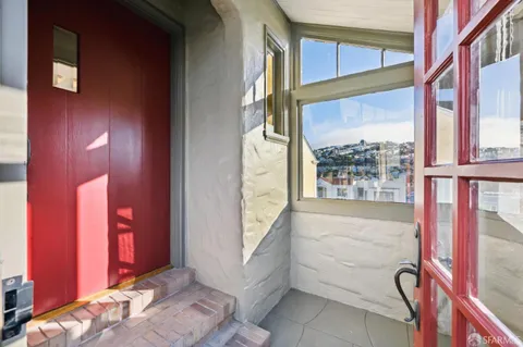 a view of a livingroom with furniture and a fireplace