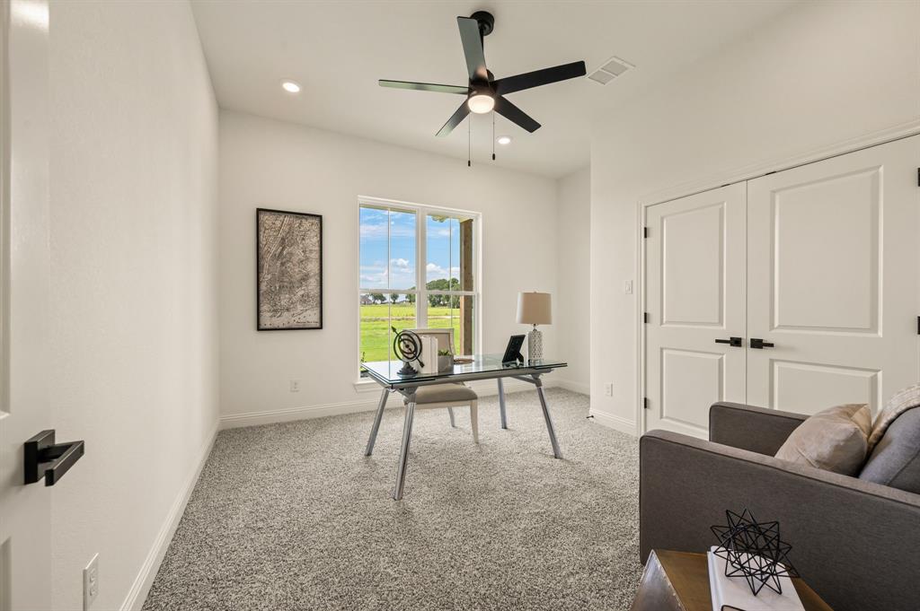 2705 Gospel Road Tolar, TX 76476 - Photo 22 of 36 Bright interior space featuring a large window, recessed lighting, and a ceiling fan