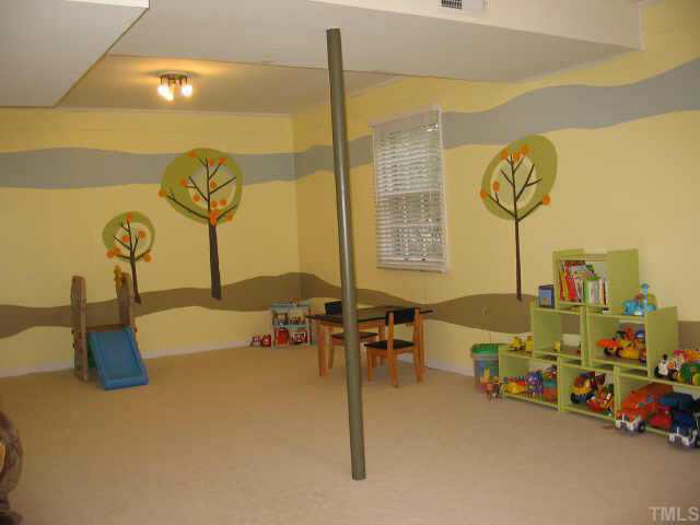 416 Crescent Court Raleigh, NC 27609 - Photo 9 of 10 Huge family room ideal for children's play room or teenager's retreat. There is a finished office area off the family room. Other