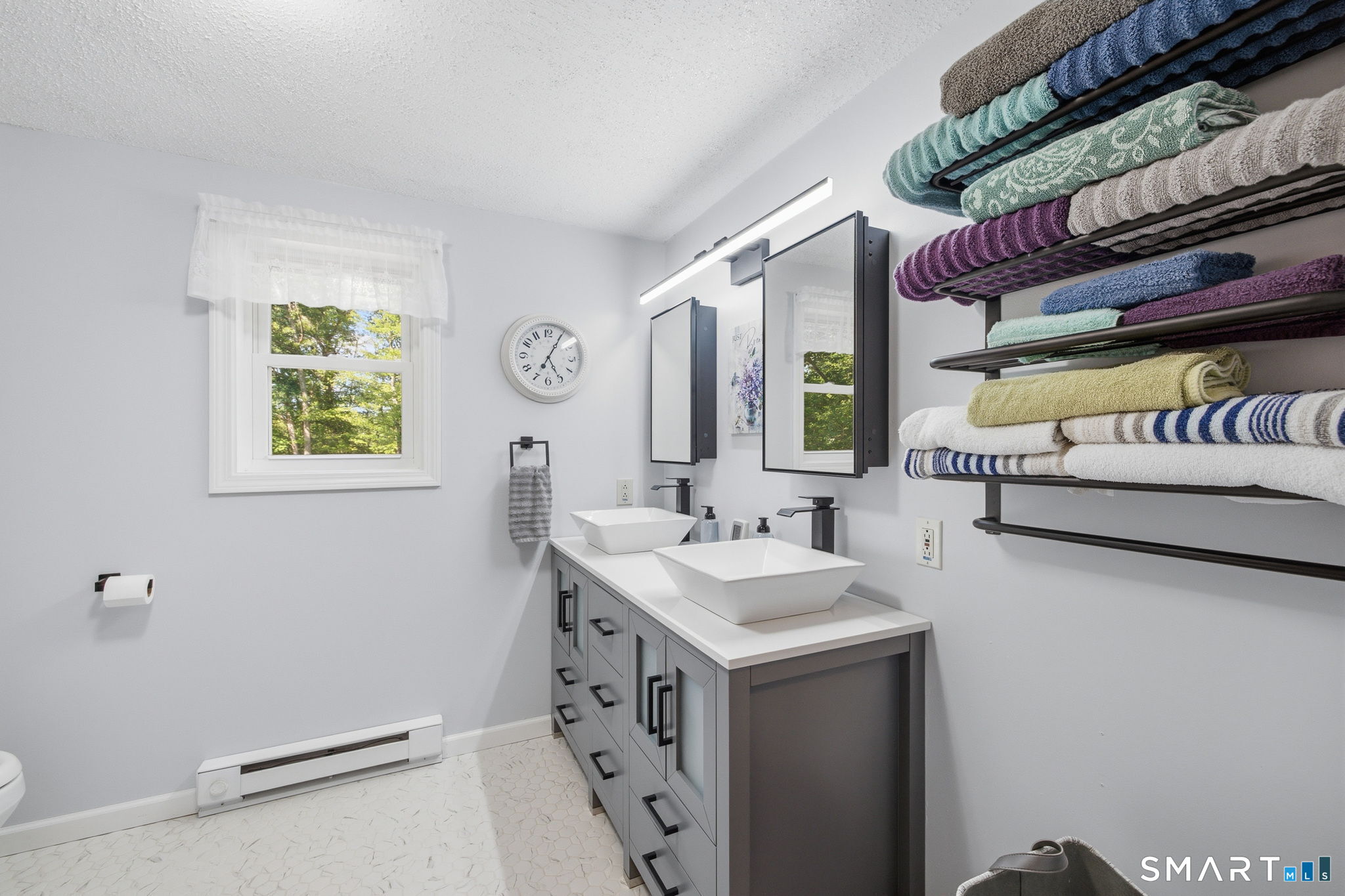 141 Hop River Road Coventry, CT 06238 - Photo 19 of 40 a bathroom with a sink and a mirror