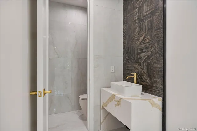 a bathroom with a sink and toilet