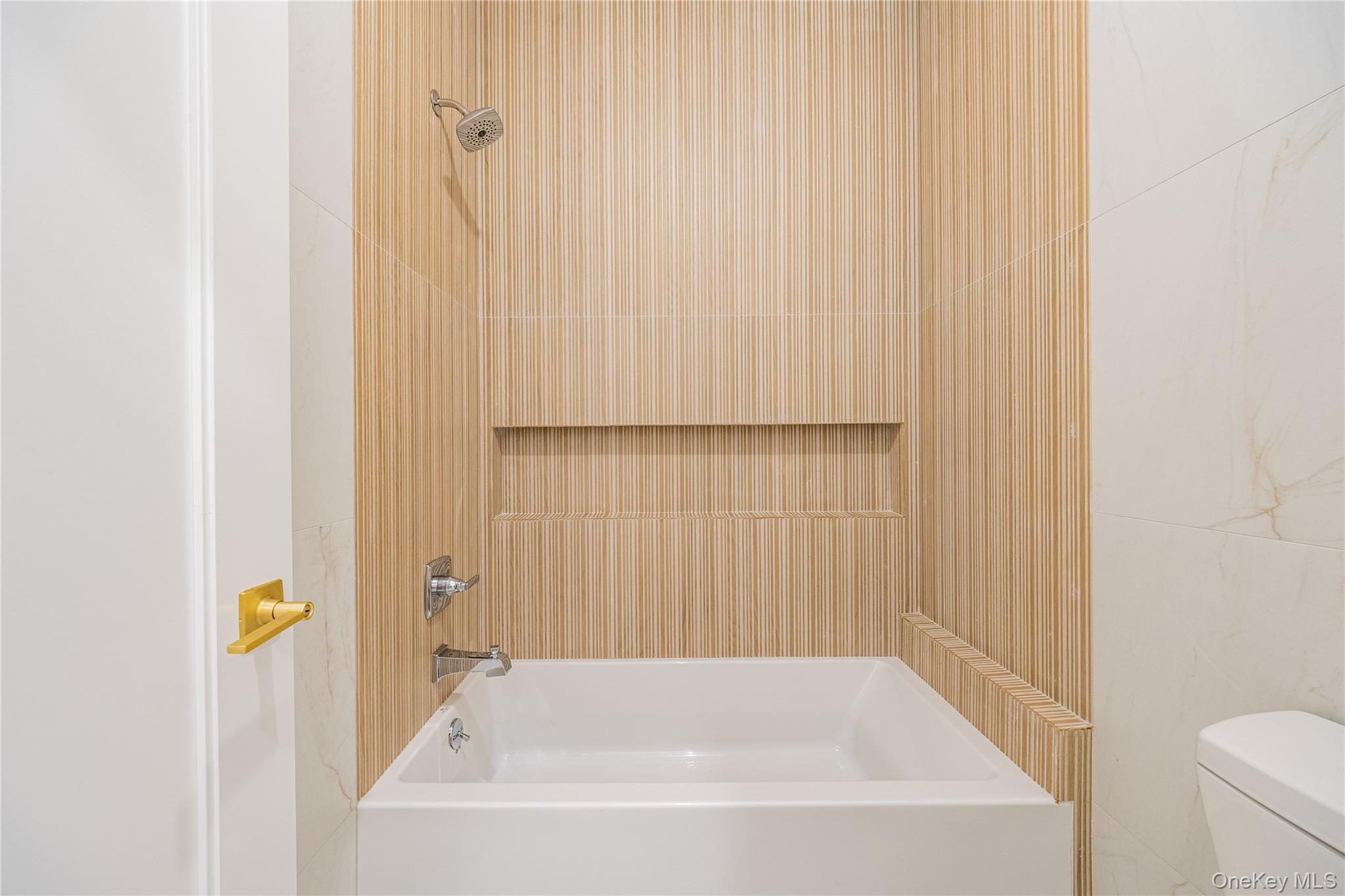 15 Northbrook Road, Unit 201 Spring Valley, NY 10977 - Photo 26 of 50 a bathroom with a bathtub