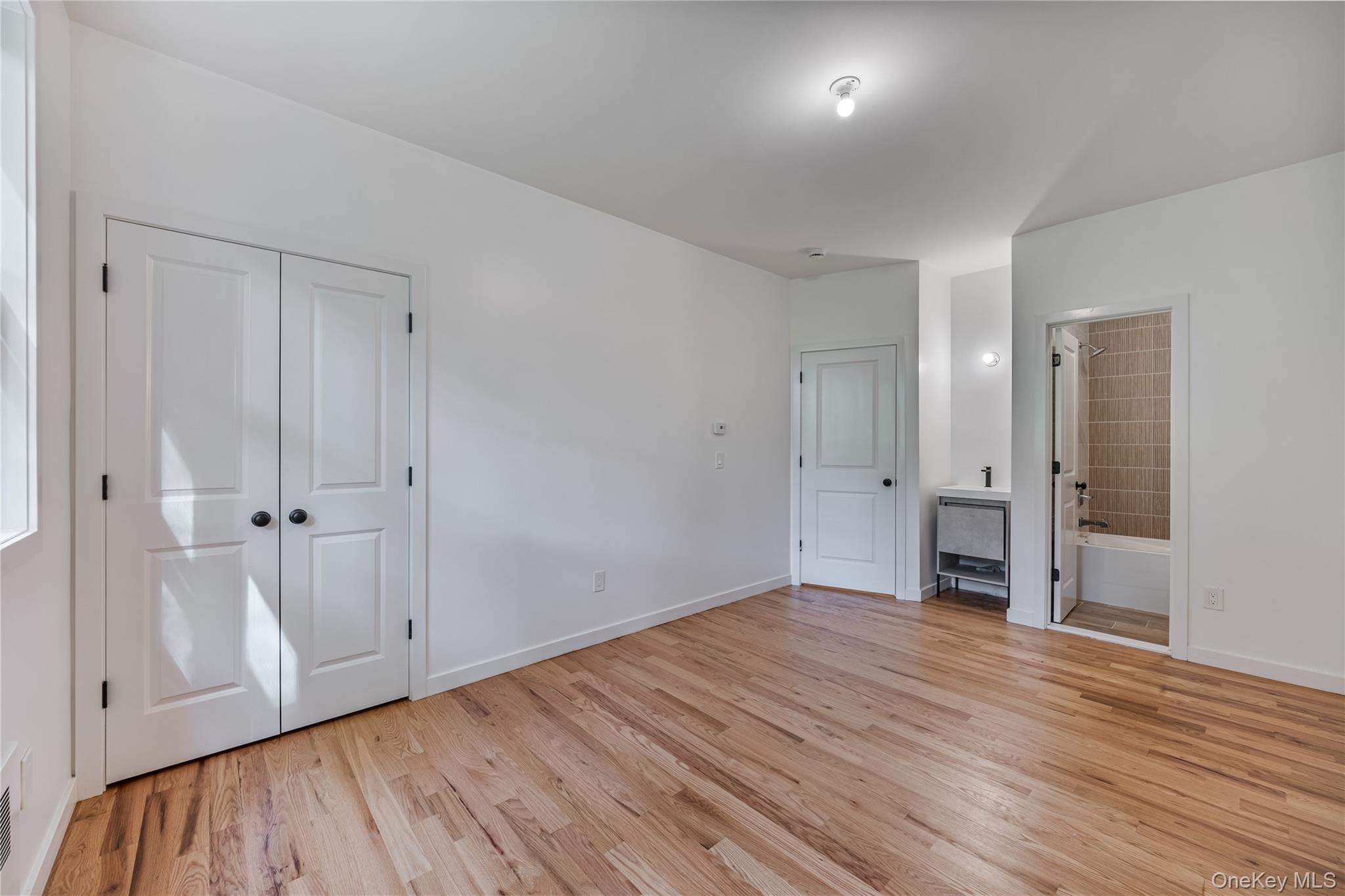 15 Northbrook Road, Unit 201 Spring Valley, NY 10977 - Photo 40 of 50 a view of an empty room with wooden floor and closet