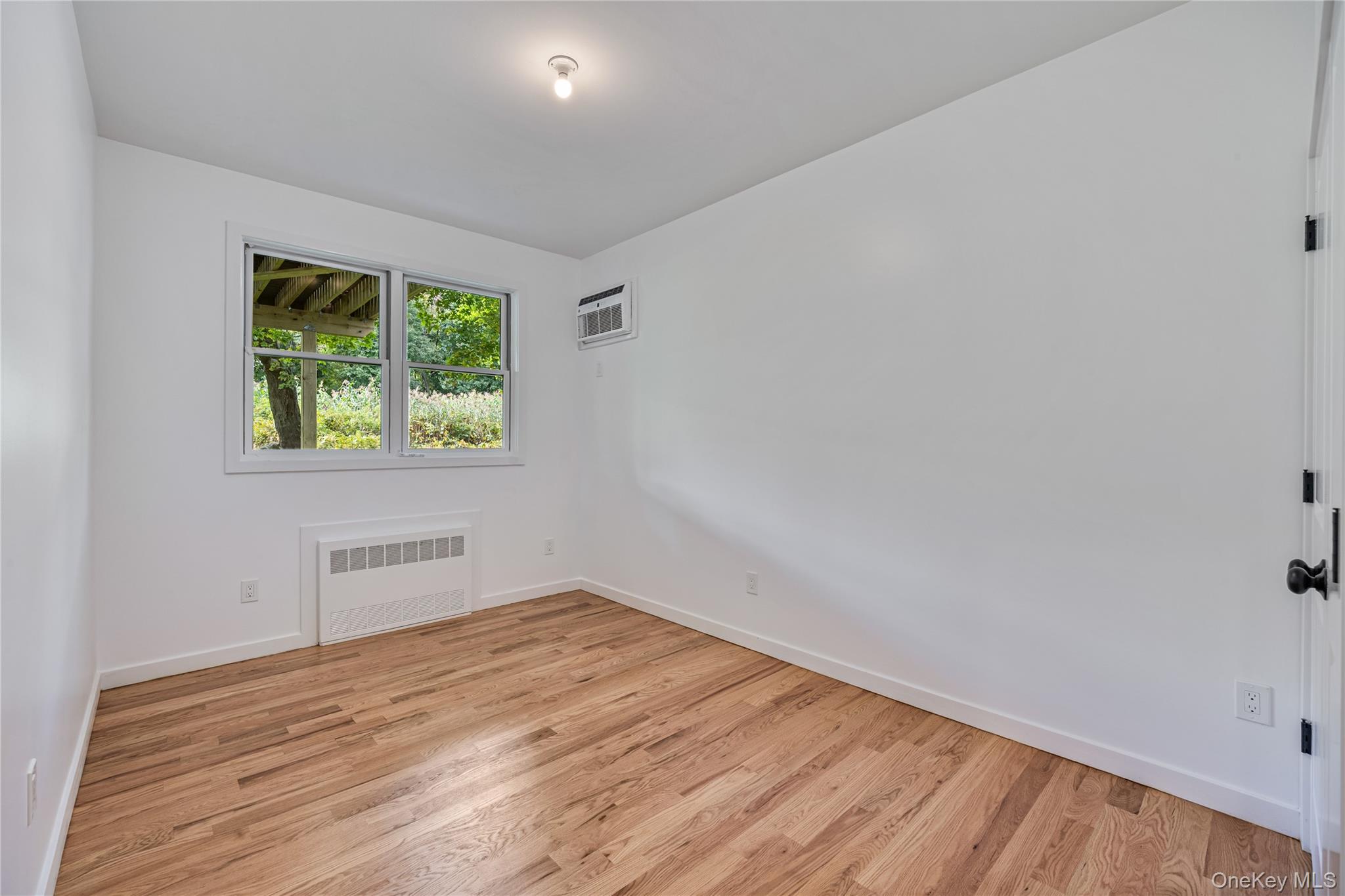 15 Northbrook Road, Unit 201 Spring Valley, NY 10977 - Photo 43 of 50 a view of empty room with wooden floor and fan