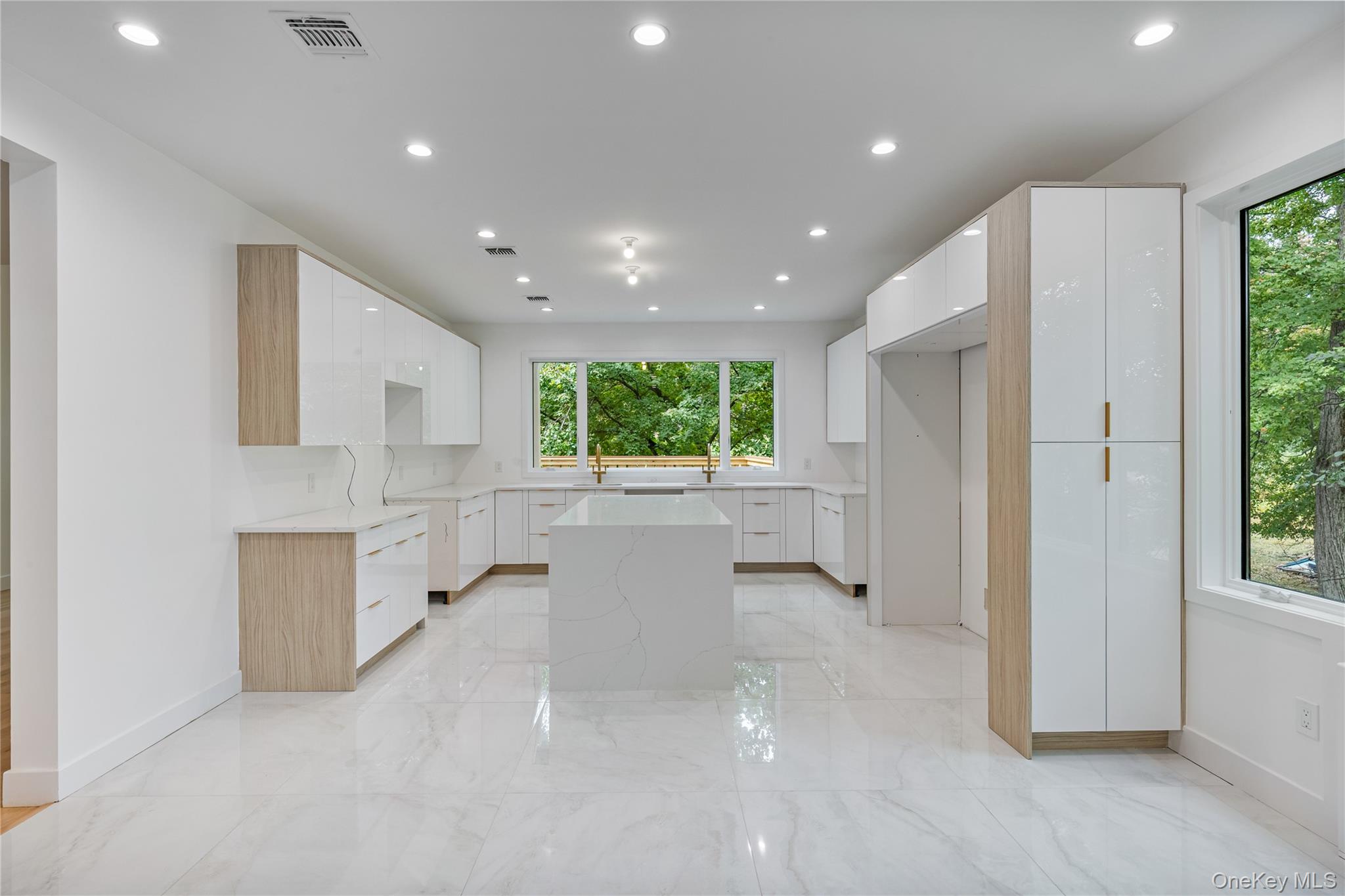 15 Northbrook Road, Unit 201 Spring Valley, NY 10977 - Photo 9 of 50 a view of a kitchen with kitchen island a window a counter space and a sink