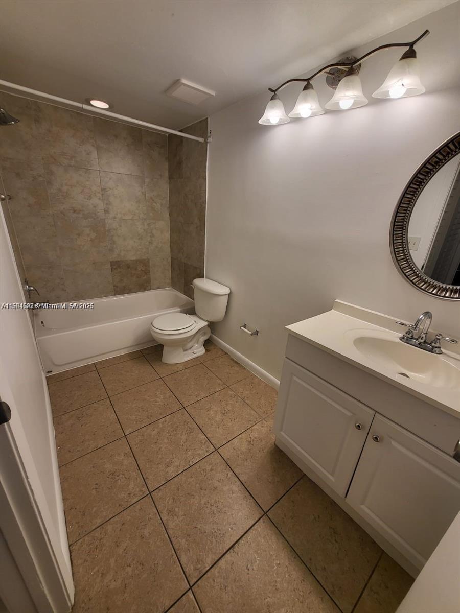 5654 Rock Island Road, Unit 222 Tamarac, FL 33319 - Photo 16 of 21 a bathroom with a sink toilet and shower