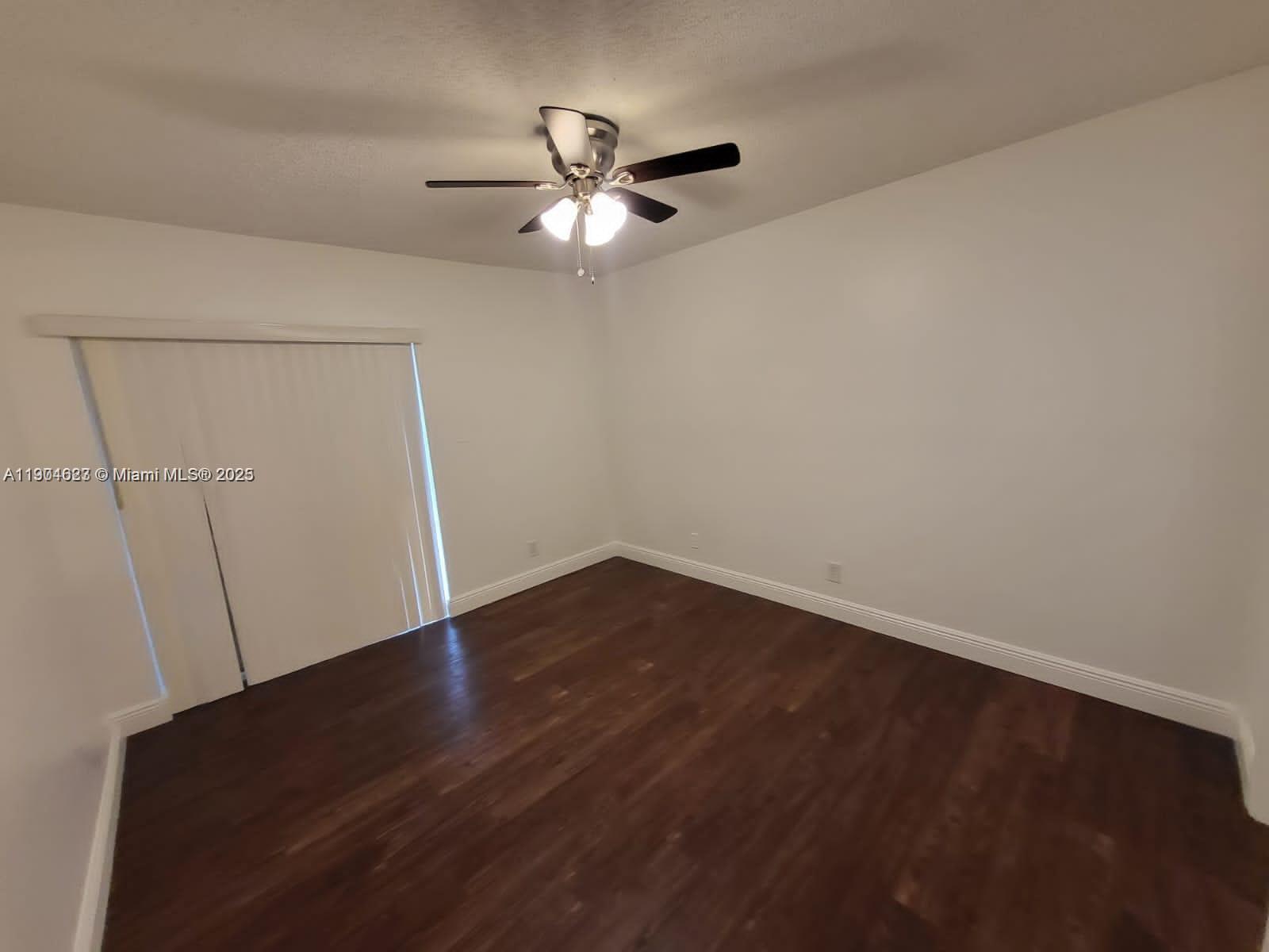 5654 Rock Island Road, Unit 222 Tamarac, FL 33319 - Photo 8 of 21 a view of an empty room with a fan