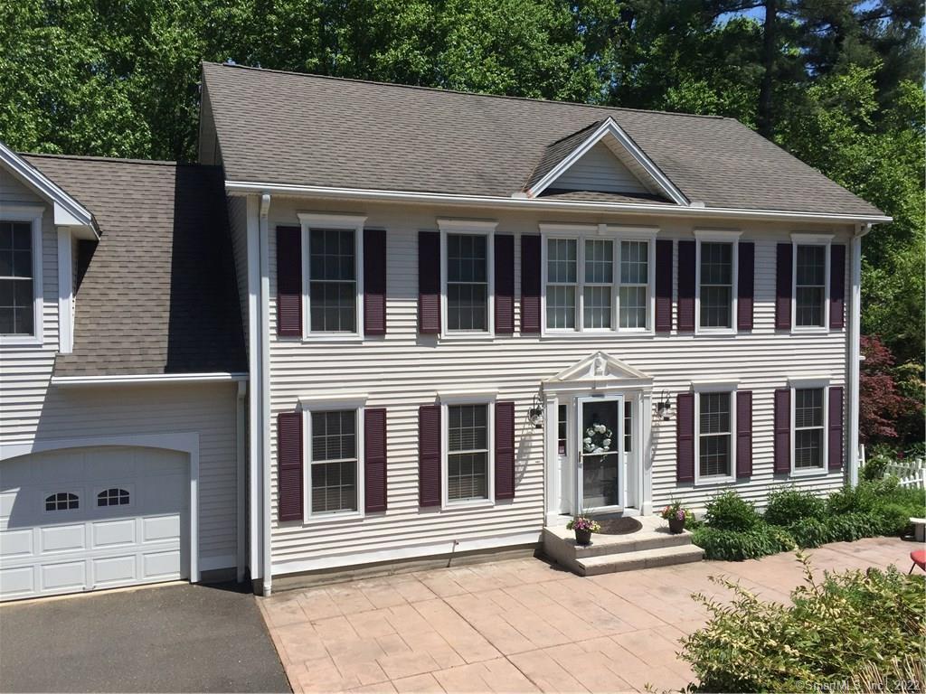 396 Long Meadow Road Middlebury, CT 06762 - Photo 1 of 1 a front view of a house with a garden