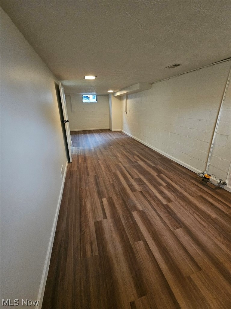 3439 Surrey Road Southeast Warren, OH 44484 - Photo 22 of 32 Lower level bonus room with wood-style flooring