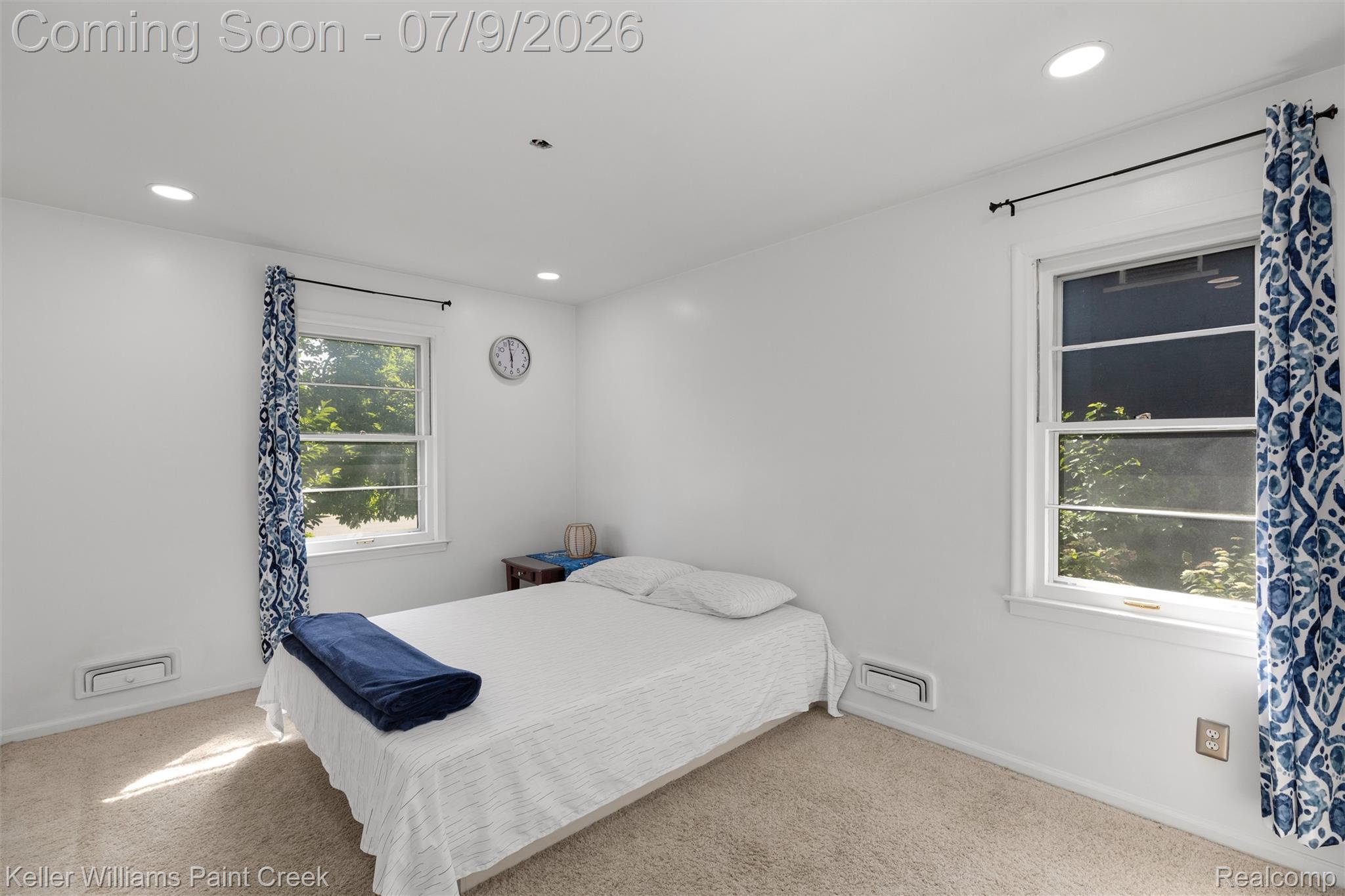 2731 Crooks Road Royal Oak, MI 48073 - Photo 2 of 34 Bright room featuring two windows, recessed lighting, white walls, and carpet flooring