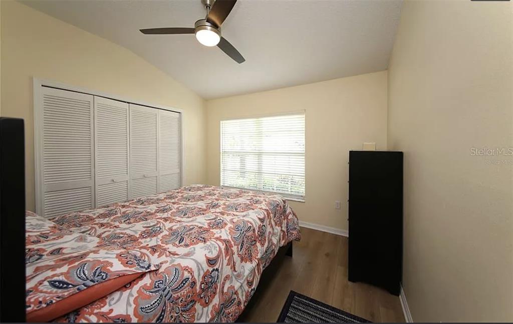 5324 Cottonwood Tree Circle Valrico, FL 33596 - Photo 16 of 27 a bedroom with a bed and a window