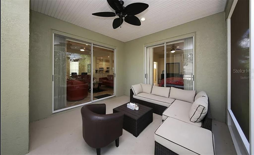 5324 Cottonwood Tree Circle Valrico, FL 33596 - Photo 20 of 27 a living room with furniture and a large window