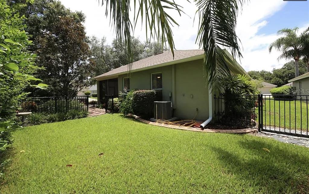 5324 Cottonwood Tree Circle Valrico, FL 33596 - Photo 24 of 27 a view of backyard of house with green space