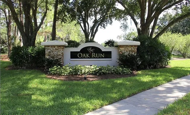 a view of sign board with green space