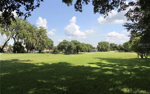 a view of a golf course with a lake