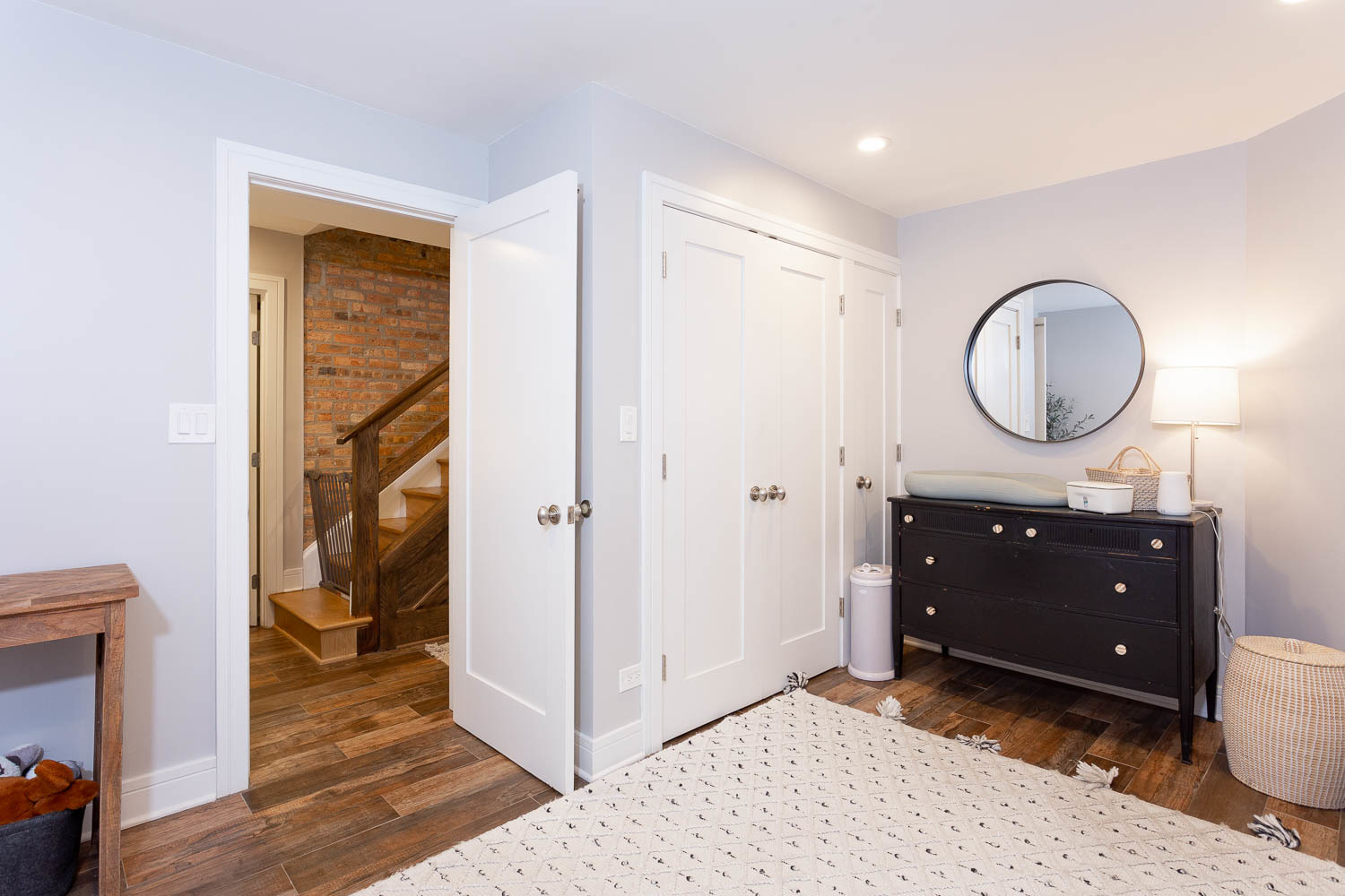 2026 North Howe Street, Unit 1 Chicago, IL 60614 - Photo 30 of 40 a room with a dresser and a mirror