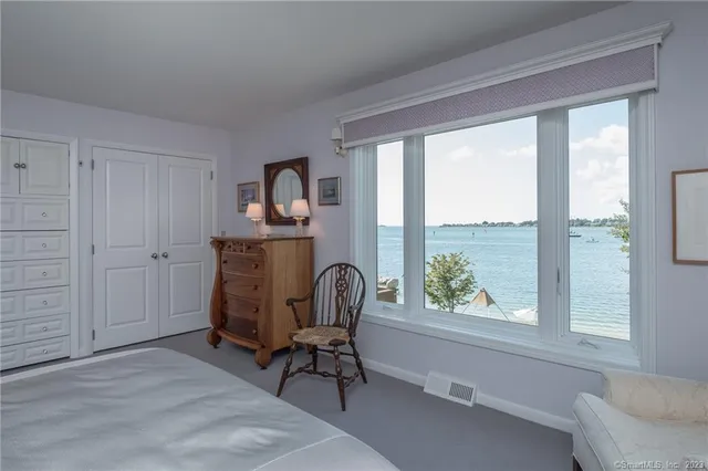 a room that has a dresser in it