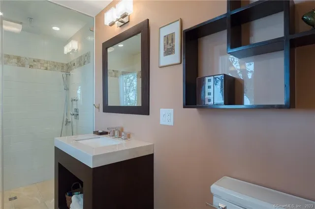 a bedroom with a bed and a television