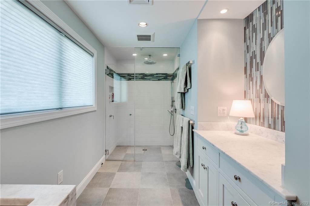 10 Morgan Point Groton, CT 06340 - Photo 33 of 40 a bathroom with a sink a toilet a mirror and shower