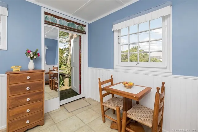 a kitchen with a window a sink and a refrigerator