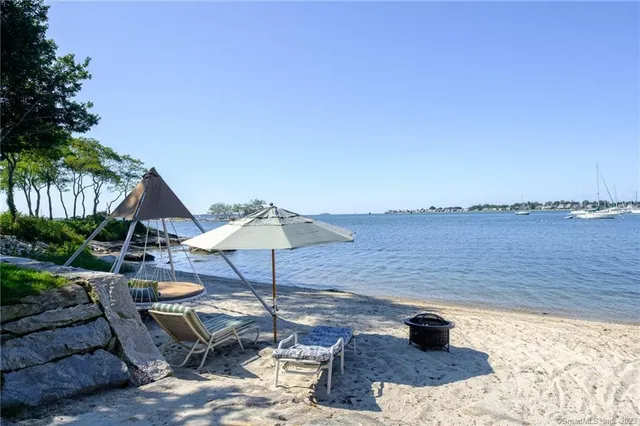 a lake view with outdoor seating space