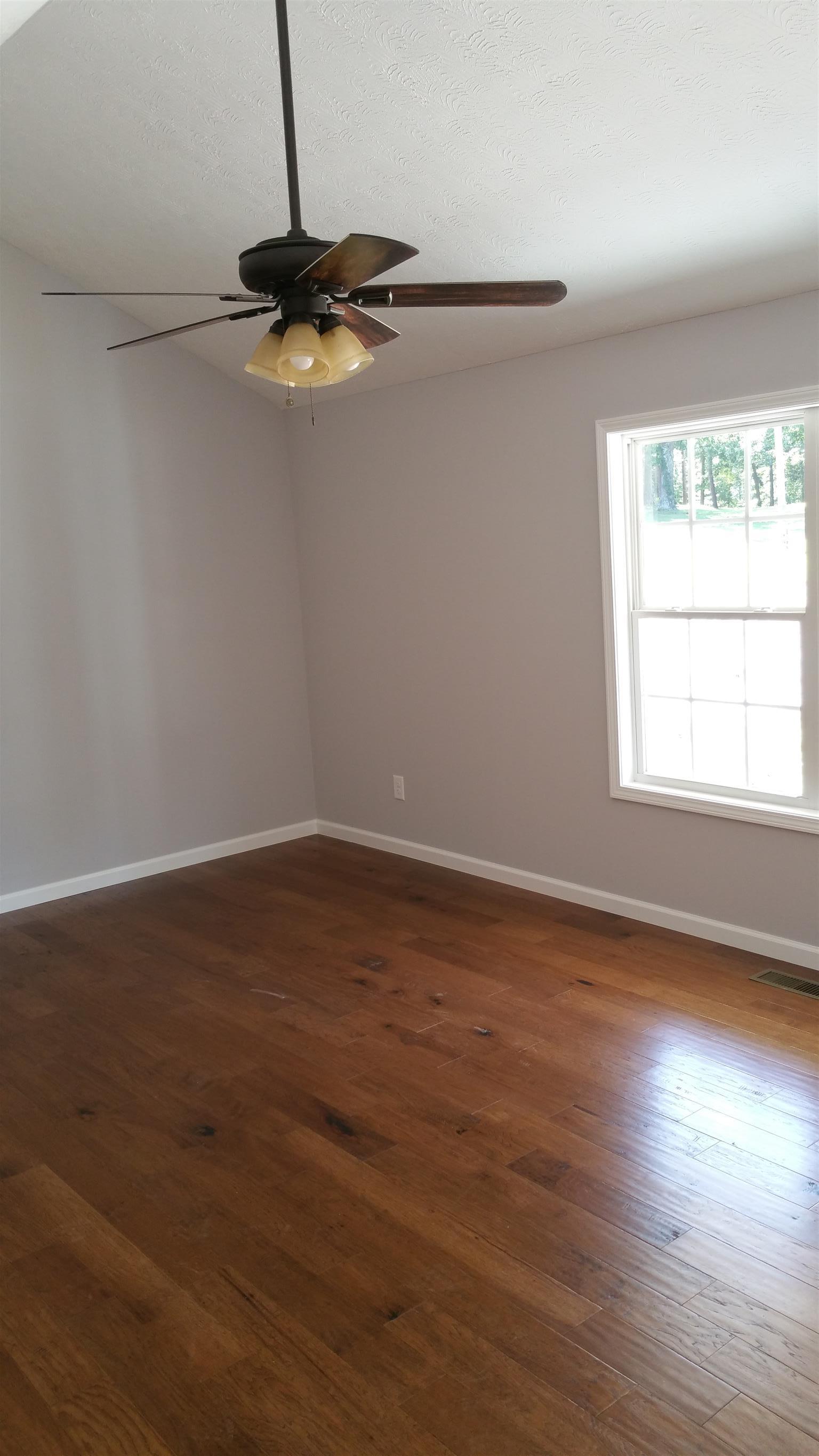 1227 East Ab Wade Road Portland, TN 37148 - Photo 3 of 9 a view of a room with wooden floor cabinets and a window