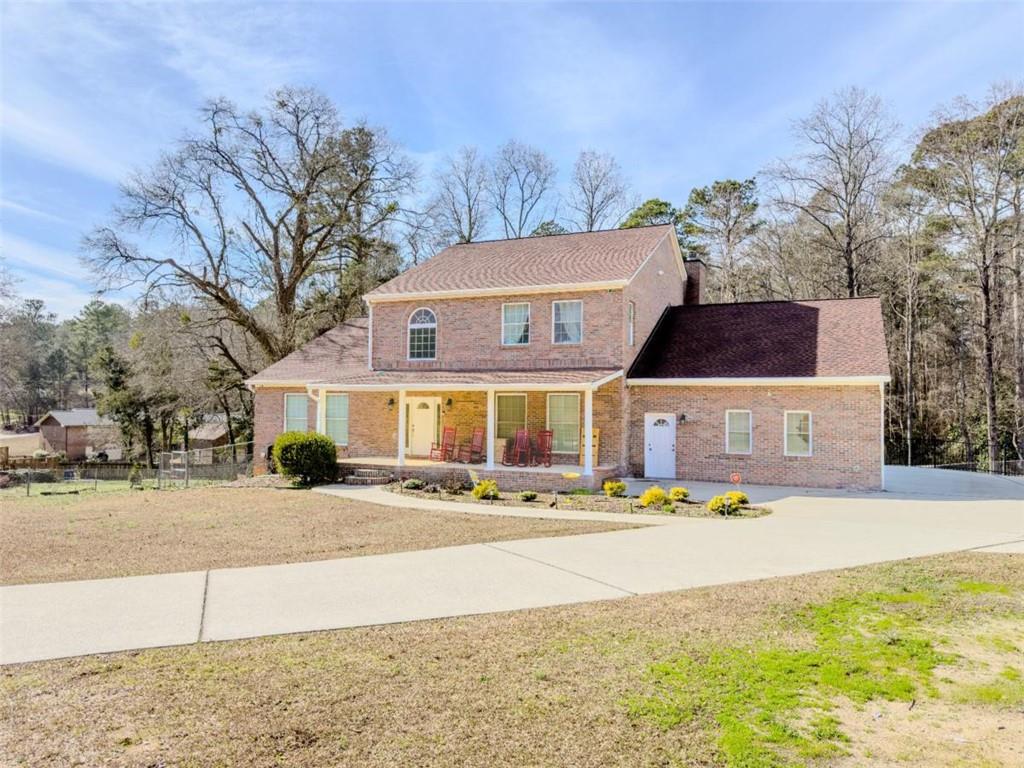 2904 Union Grove Road Conyers, GA 30012 - Photo 2 of 2 a front view of house with yard and trees around