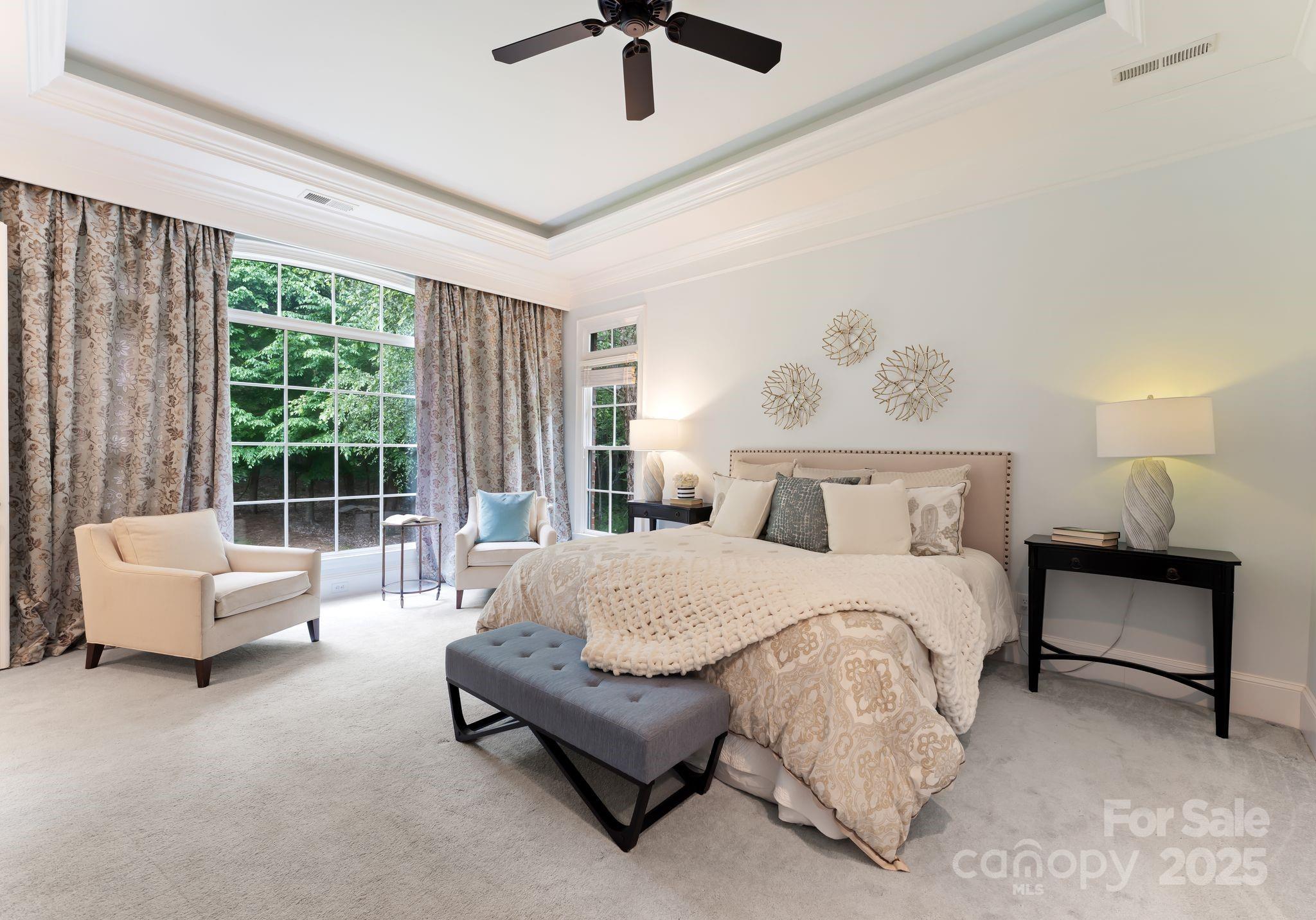 408 Covington Crossing Matthews, NC 28104 - Photo 22 of 46 a spacious bedroom with a bed and a couch