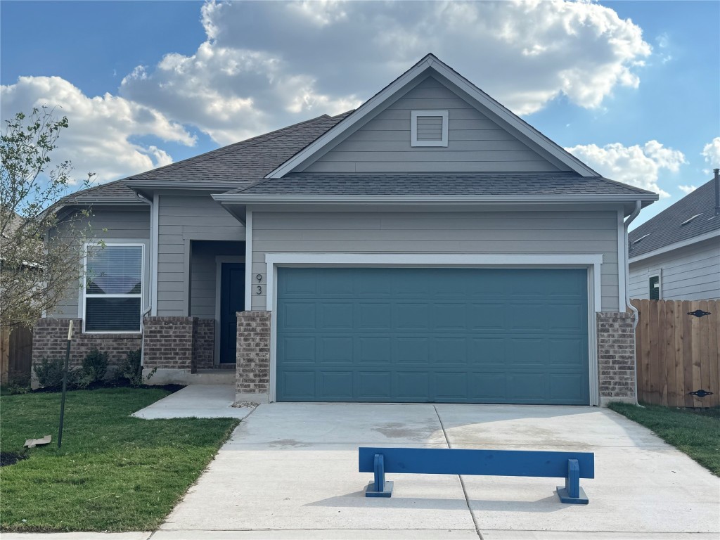 a view of house with backyard