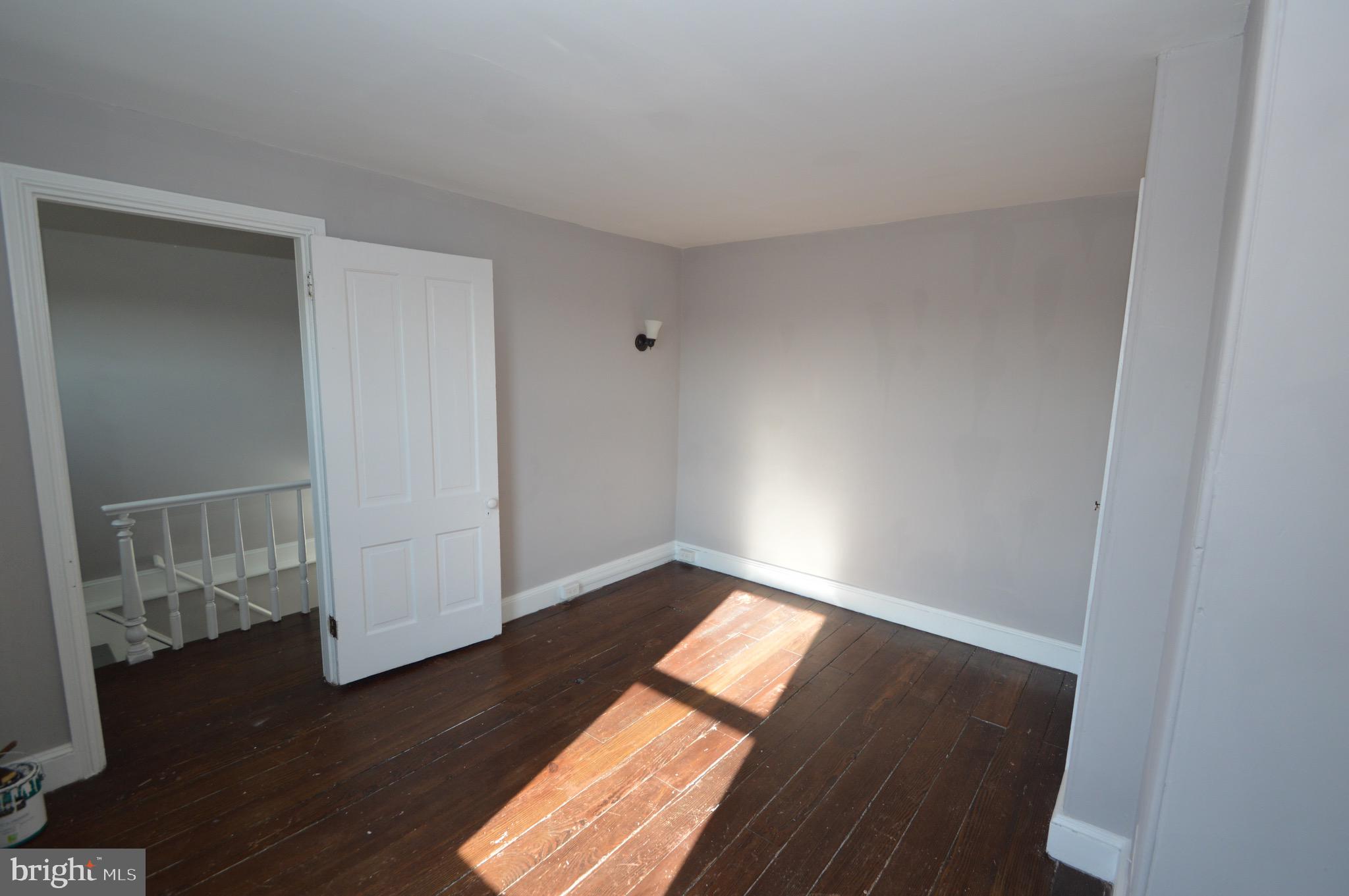 348 Barclay Street Burlington, NJ 08016 - Photo 19 of 21 an empty room with wooden floor and windows