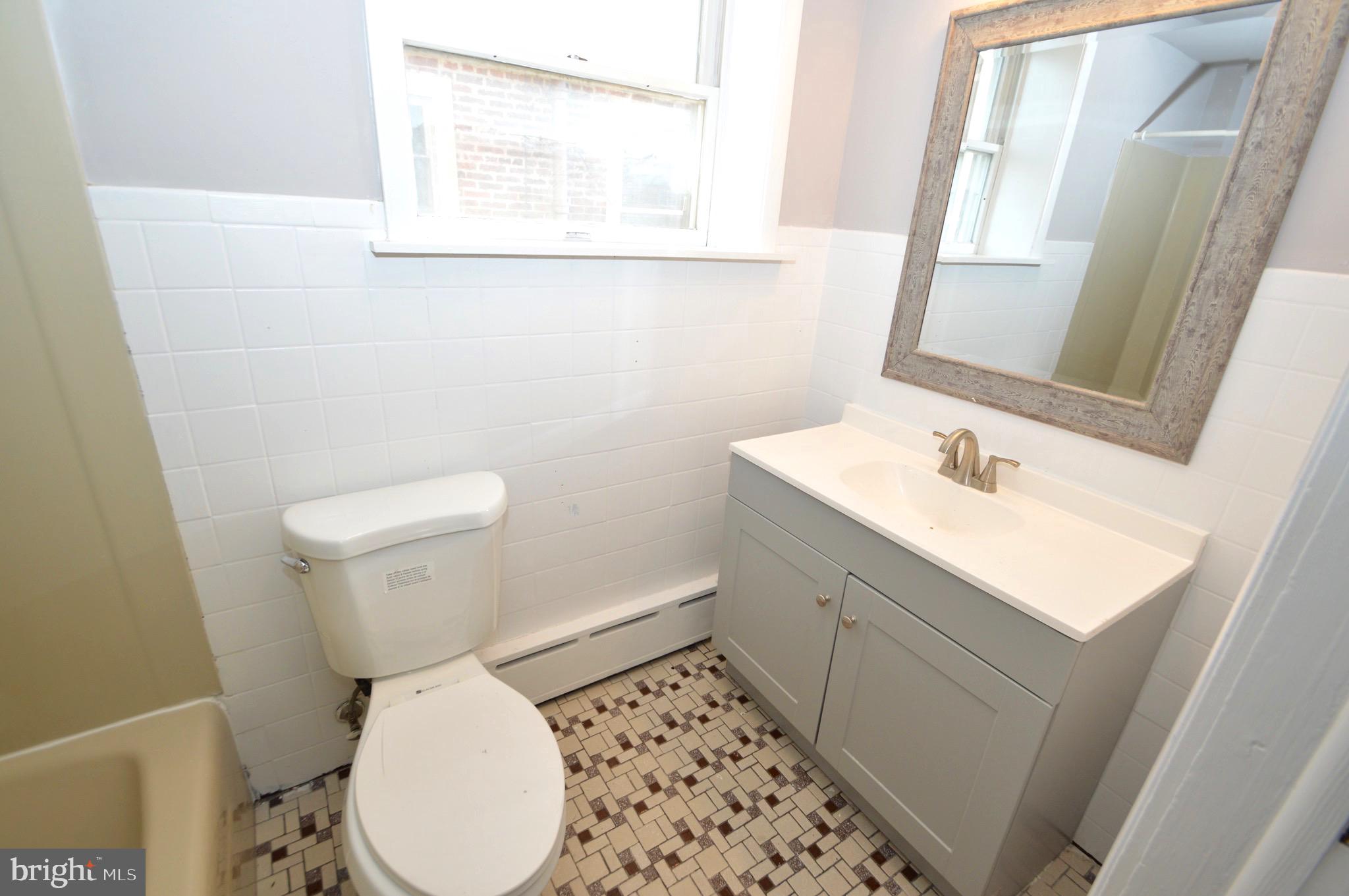 348 Barclay Street Burlington, NJ 08016 - Photo 20 of 21 a white toilet sitting next to a bathroom sink