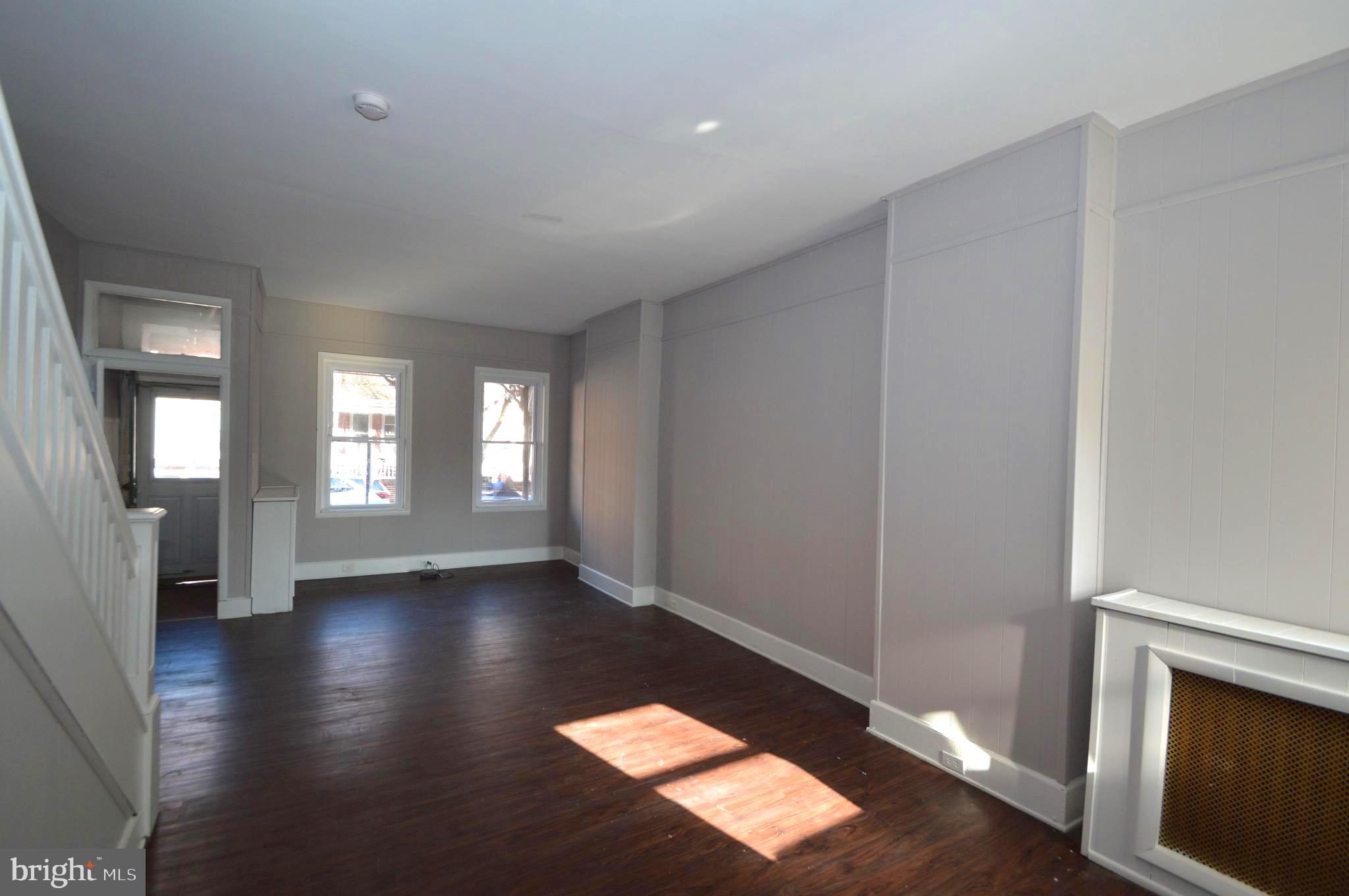 348 Barclay Street Burlington, NJ 08016 - Photo 4 of 21 wooden floor in an empty room with a window