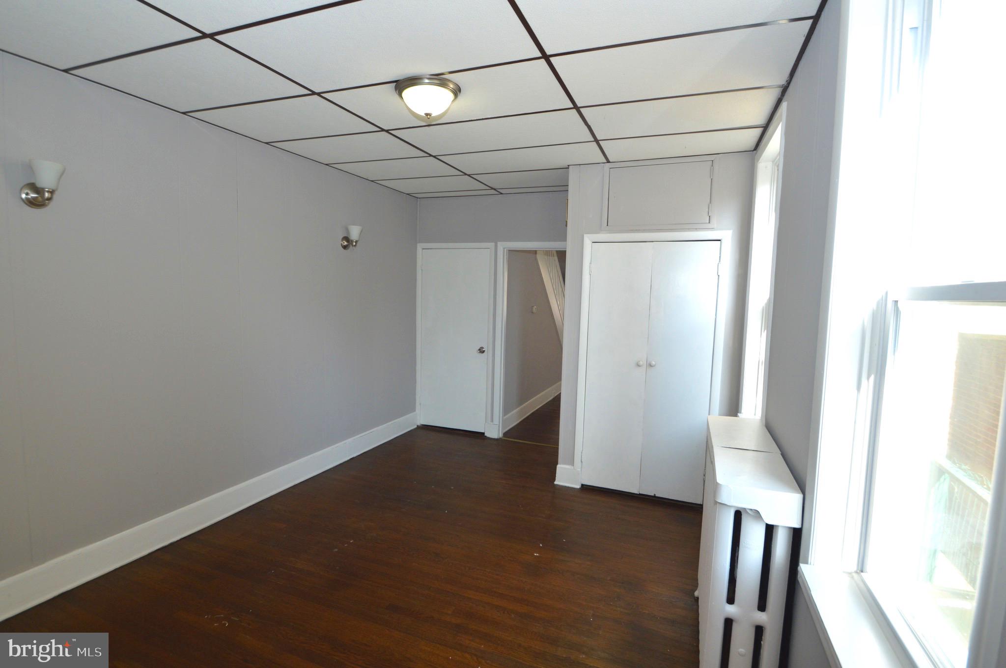 348 Barclay Street Burlington, NJ 08016 - Photo 6 of 21 a view of a room with wooden floor and a window