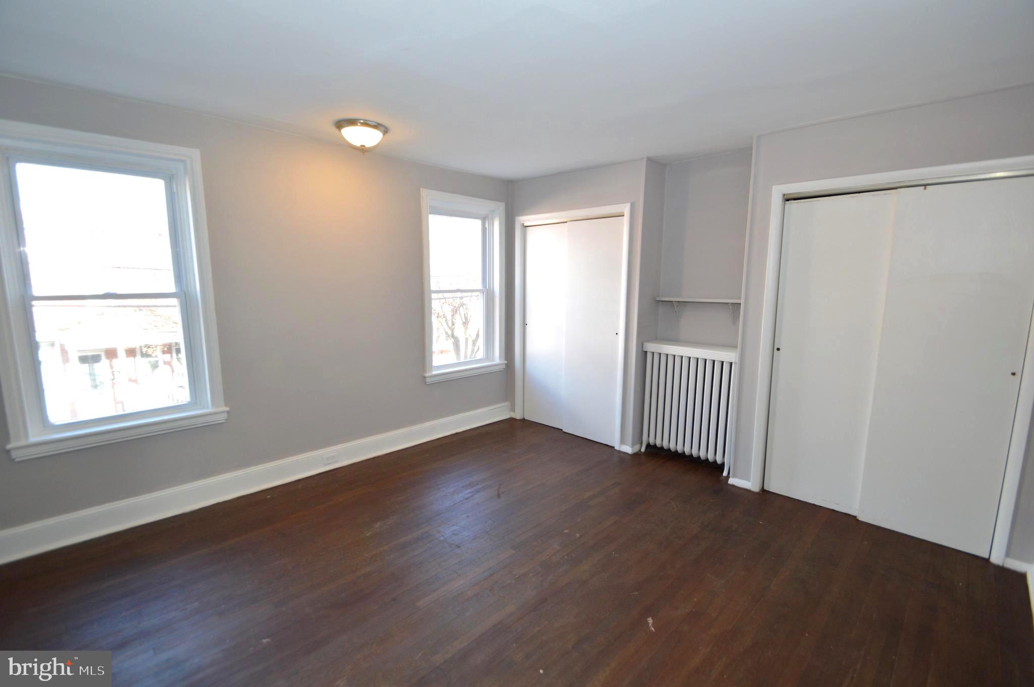 348 Barclay Street Burlington, NJ 08016 - Photo 10 of 21 a view of an empty room with wooden floor and a window