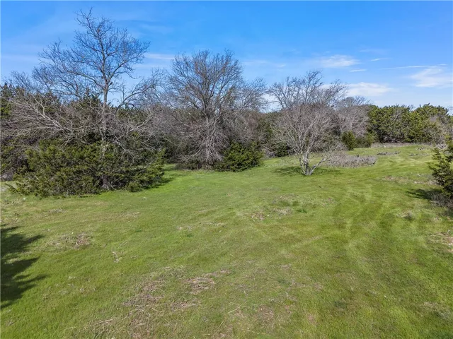 a backyard of a house with lots of green space