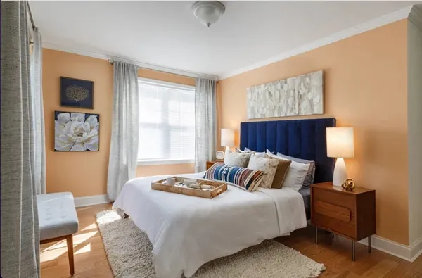 a bedroom with a bed and window