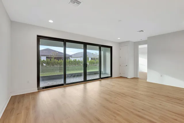 a kitchen with stainless steel appliances a refrigerator sink and microwave