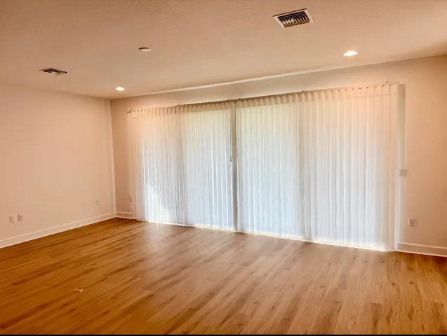 a view of a livingroom with wooden floor