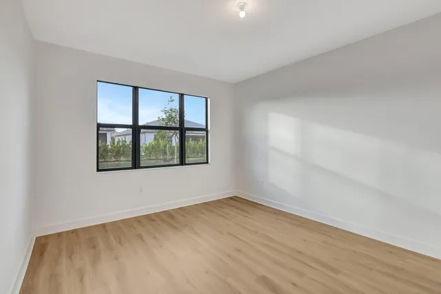 a bathroom with a double vanity sink mirror and shower