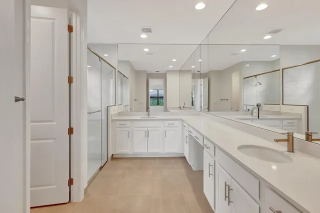 a spacious bathroom with a shower and a sink