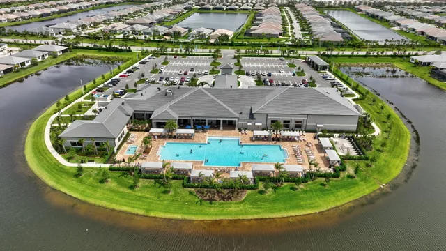 a living room with furniture and a large mirror